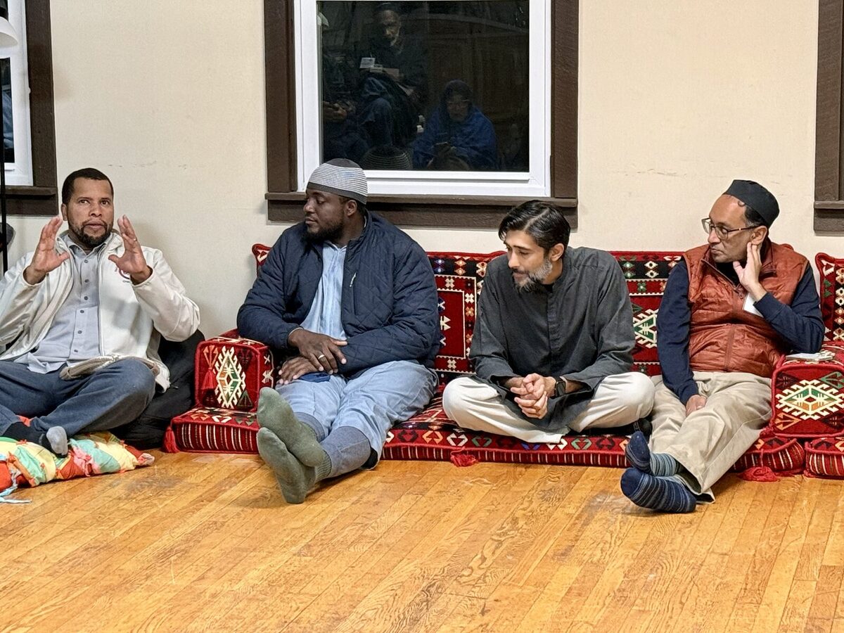 Men in discussion at retreat